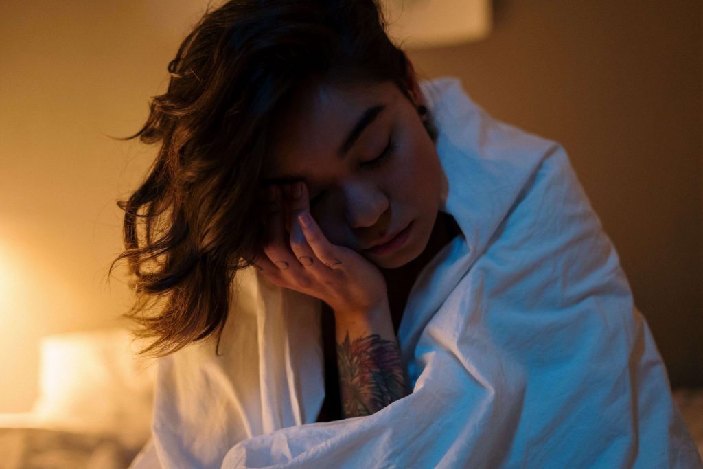 Person awake and unable to sleep, representing insomnia and nighttime restlessness associated with burnout addressed through burnout therapy in Denver, CO.
