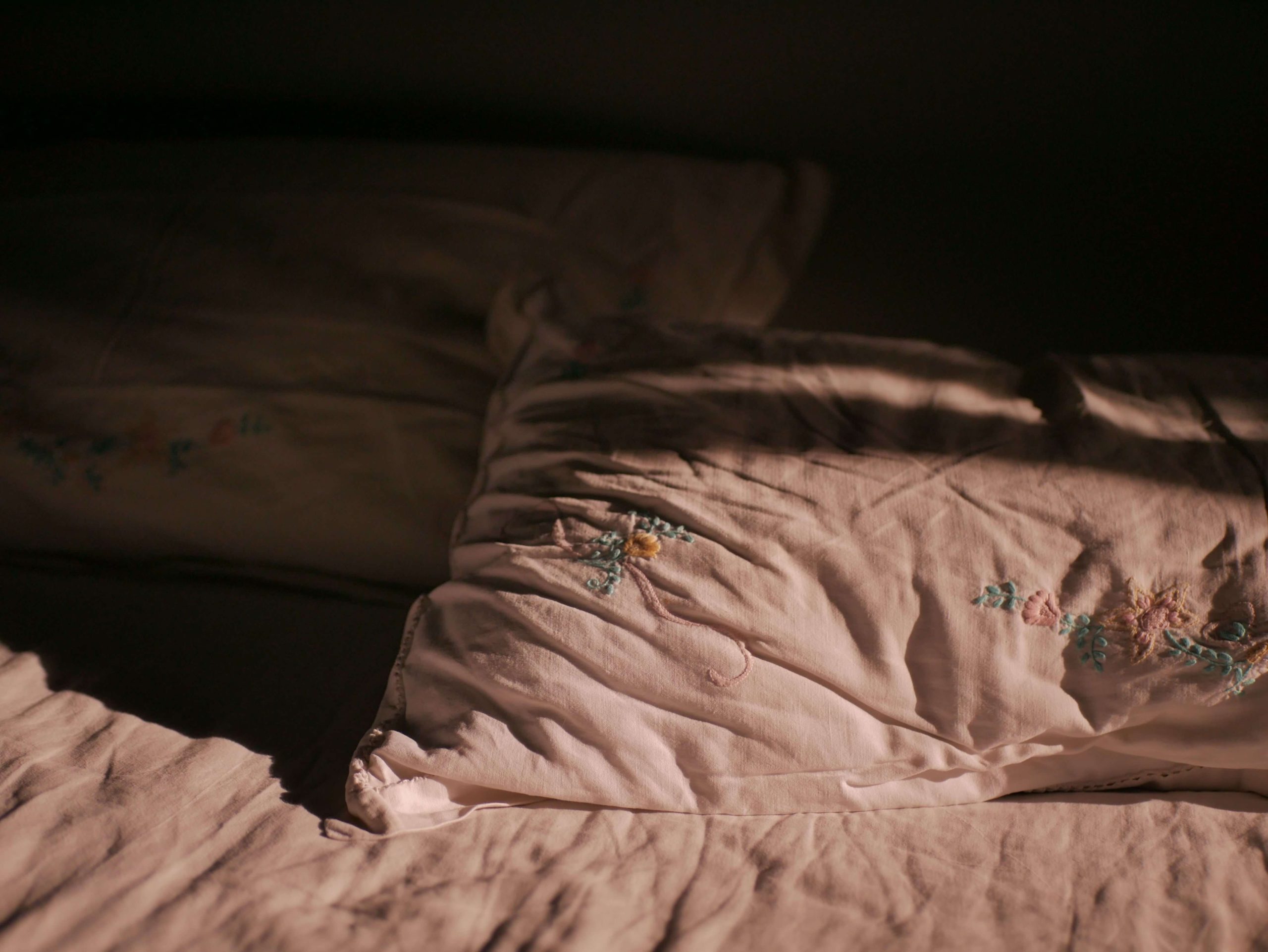 Comfortable bed representing restorative rest and support for sleep challenges associated with burnout therapy in Denver, CO.