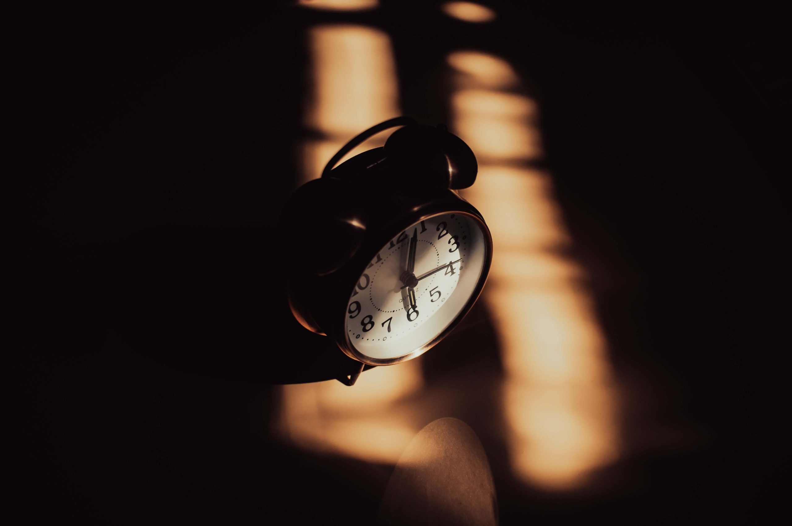 Alarm clock representing disrupted sleep schedules and the challenges of understanding neurodivergence and sleep in Denver, CO.